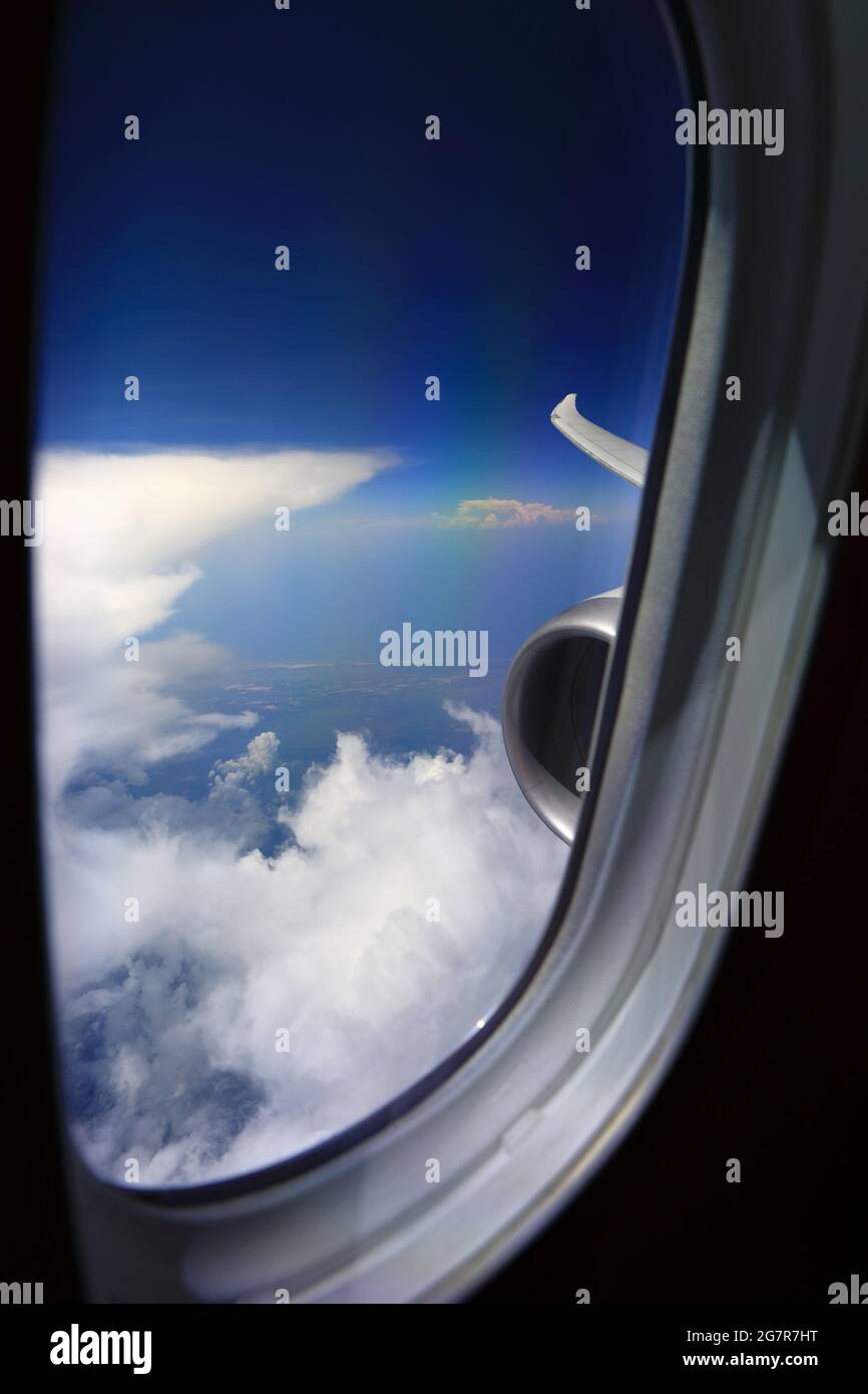 Blue sky above the clouds from an air plane window Stock Photo - Alamy