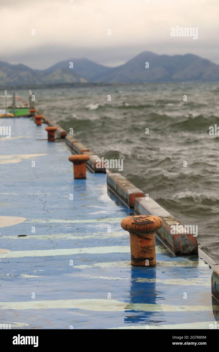 Blue Power Inawashiro orange Rusty bollard on blue pier at inawashiro lake, Japan Stock Photo ...
