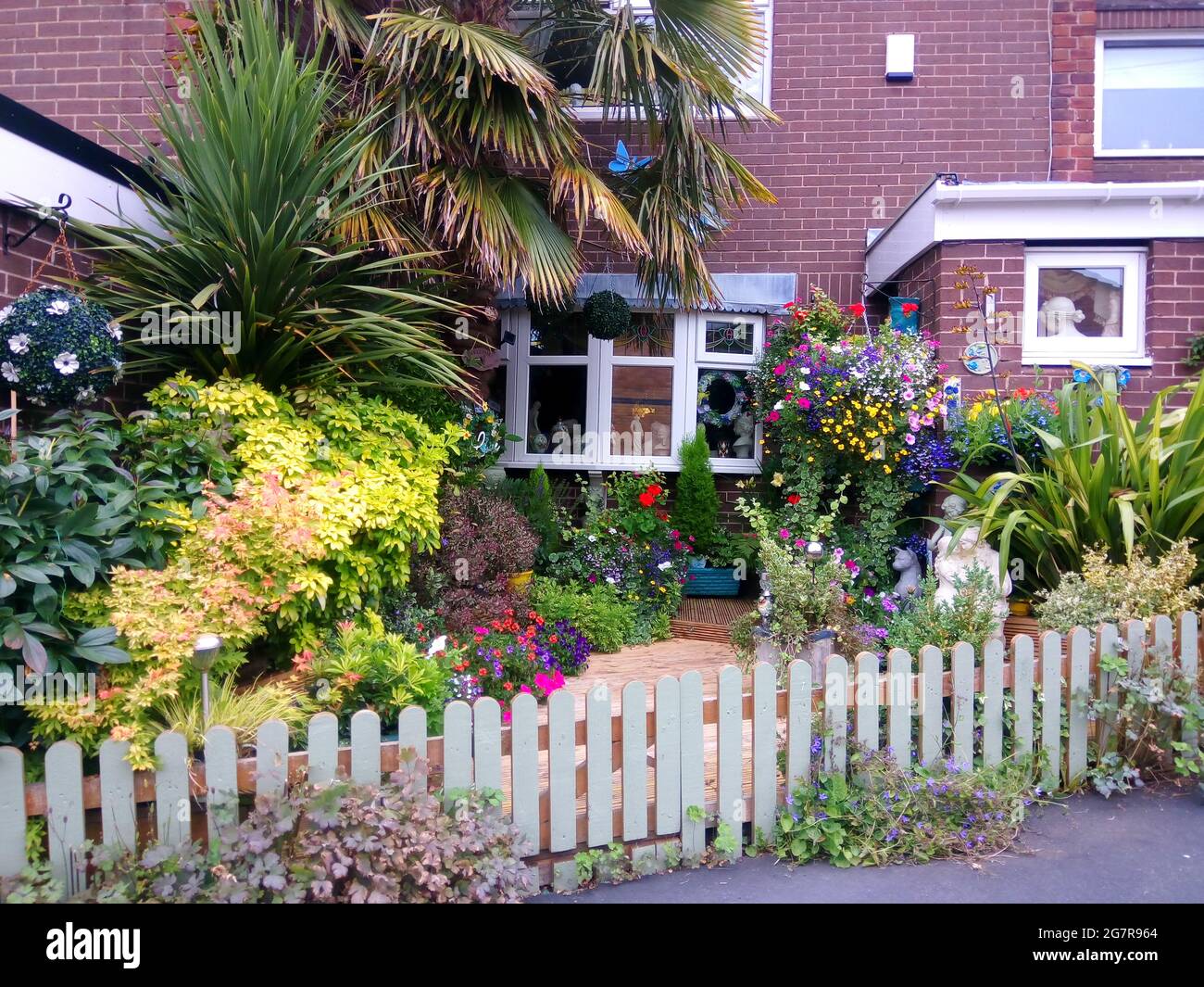 Small front garden full of colourful plants with the wow factor.. Kerb appeal concept Stock Photo