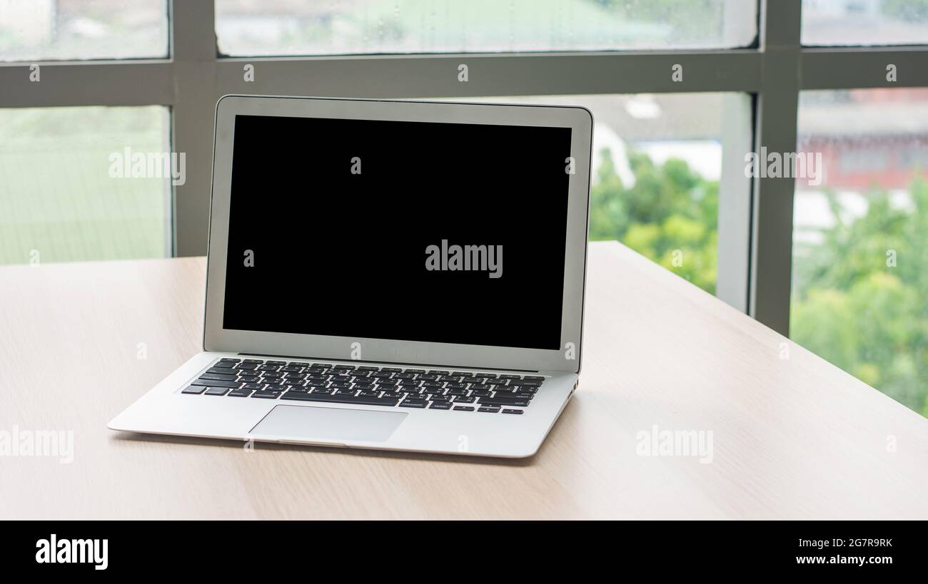 Computer notebook screen empty copy spec on desk in office , Laptop