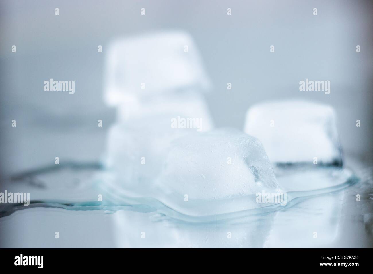 Stack of ice cubes with reflection; ice cubes melting; refreshing ...