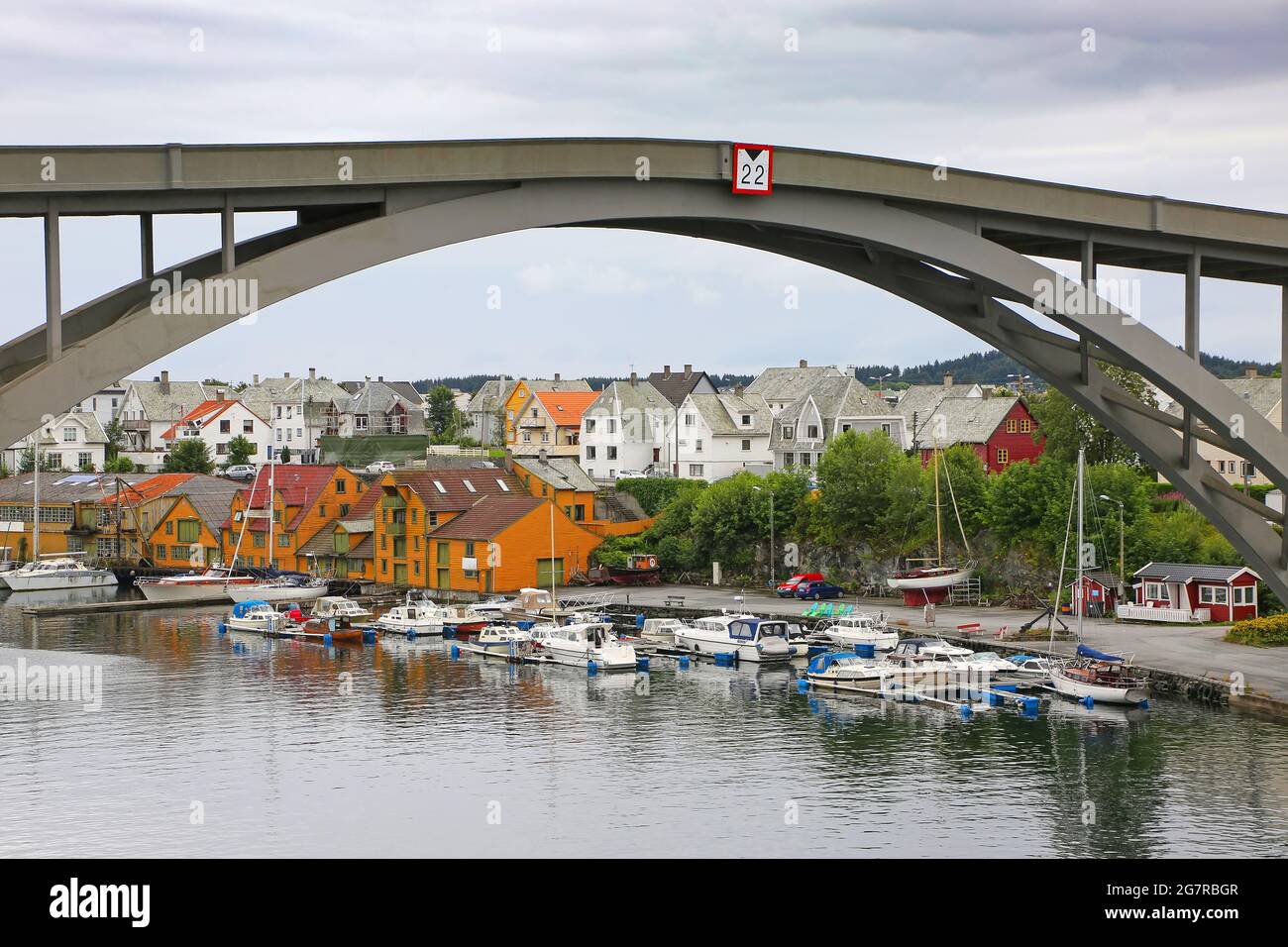 Risoy bridge over the river in the center of the town. Surrounded by traditional buildings, Haugesund, Norway. Stock Photo