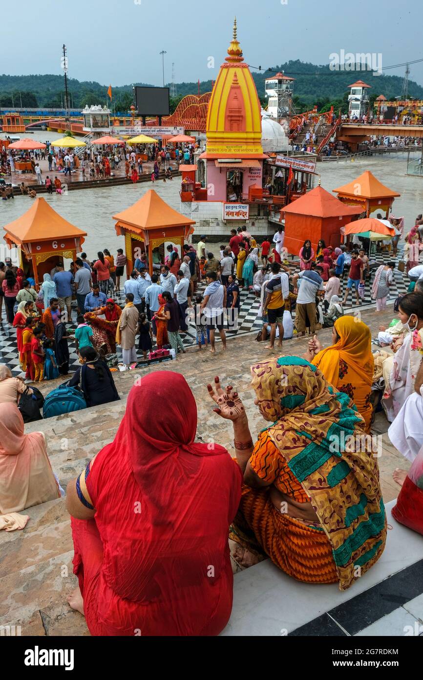 Haridwar, India - July 2021: Pilgrims bathing in the Ganges River at Haridwar on July 14, 2021 in Uttarakhand, India. Stock Photo