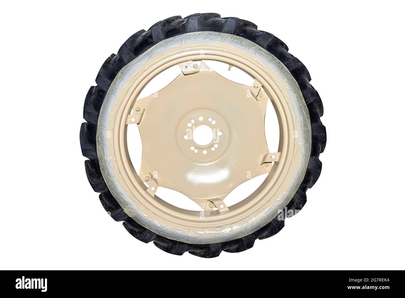Freshly painted rims in a light color from a farm tractor, isolated on
