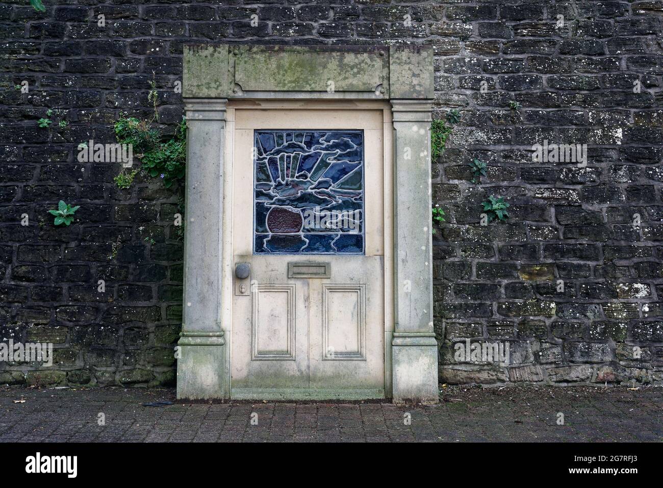 A door in a wall, what secrets lie beyond? Enter at your peril. Stock Photo