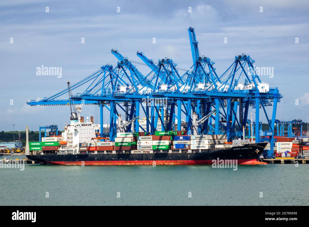 Maersk Wilmington Container Cargo Ship In Port Colon Republic Of Panama Against A Background Of Cranes Stock Photo