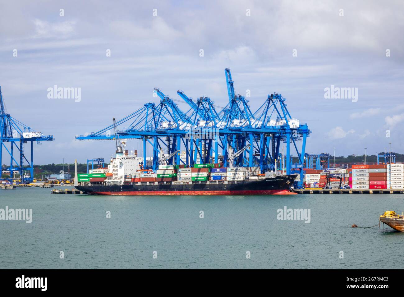 Maersk Wilmington Container Cargo Ship In Port Colon Republic Of Panama Against A Background Of Cranes Stock Photo