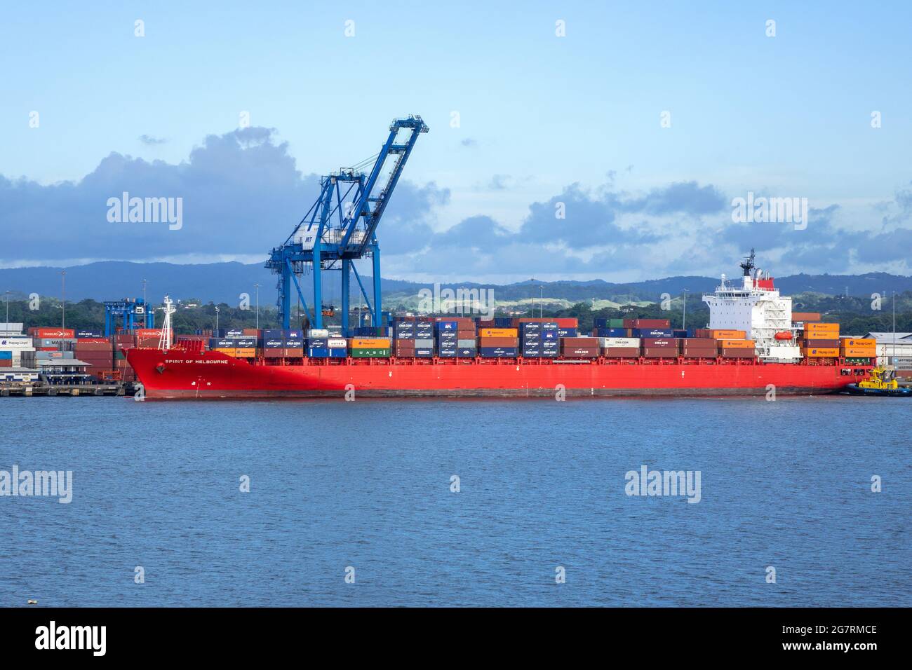 Spirit Of Melbourne Container Cargo Ship In Port Colon Republic Of Panama Against A Background Of Container Cranes Stock Photo