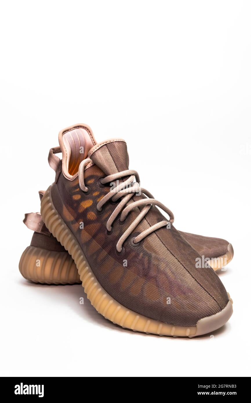 WARSAW, POLAND - Jul 06, 2021: A vertical closeup of Adidas Yeezy boost 350  V2 Mono Mist. Famous limited collection sneakers. Adidas running shoes iso  Stock Photo - Alamy