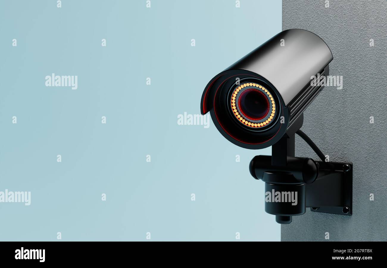 CCTV Security camera isolated on wall at blue background. Safe and secure technology inside property and homeowner concept. Copy space. 3D illustratio Stock Photo