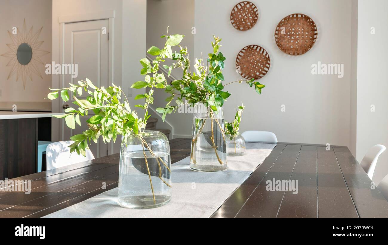 Pano Wooden plank table top at dining area with centerpiece cloth and