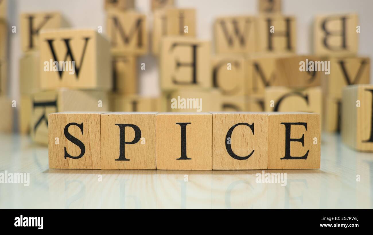 The word Spice was created from wooden letter cubes. Gastronomy and spices. close up. Stock Photo