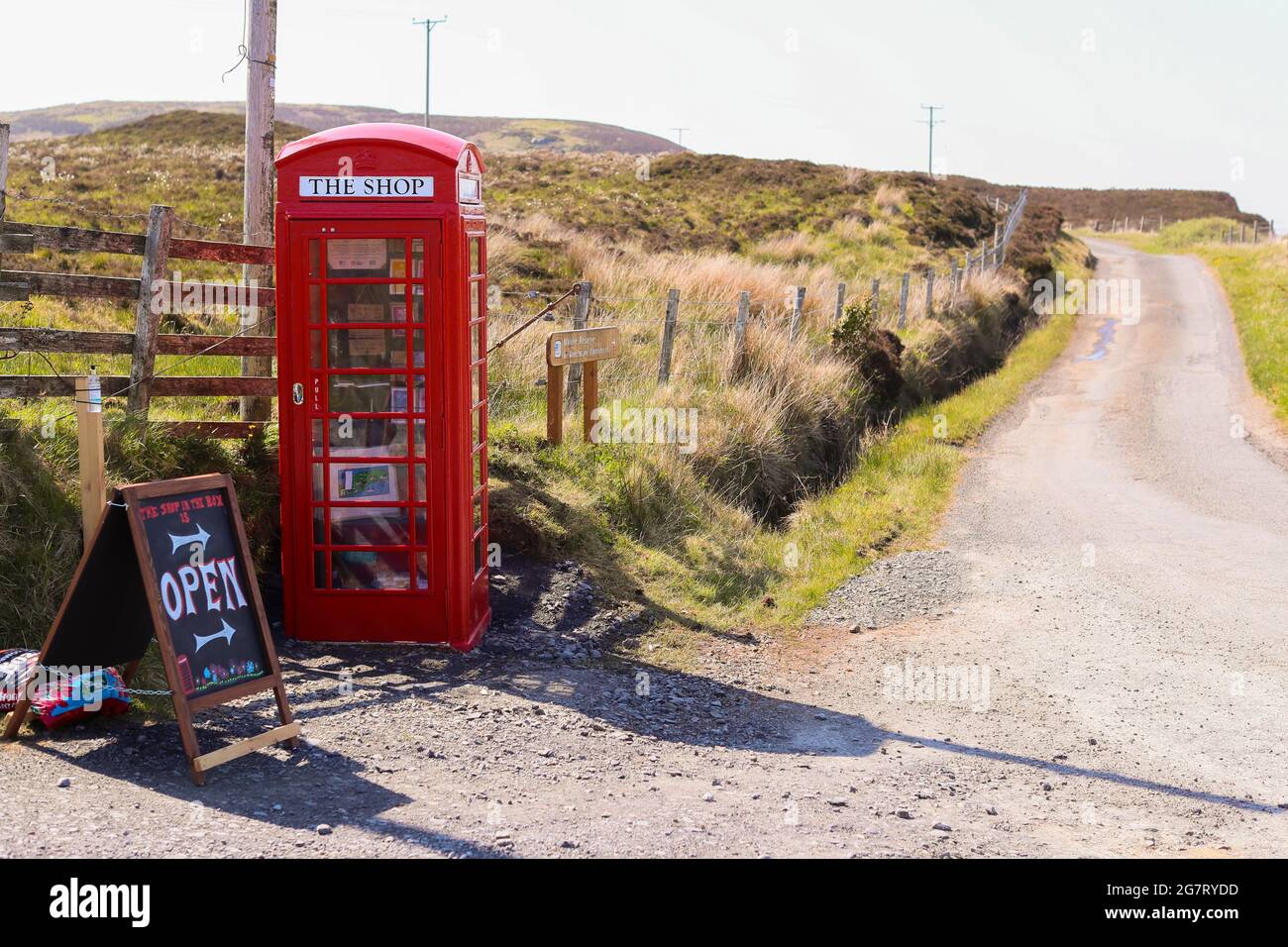 A restored Red Telephone Box on the Isle of Islay off the west coast of Scotland.  The small island is famous for it many whisky distilleries. Stock Photo