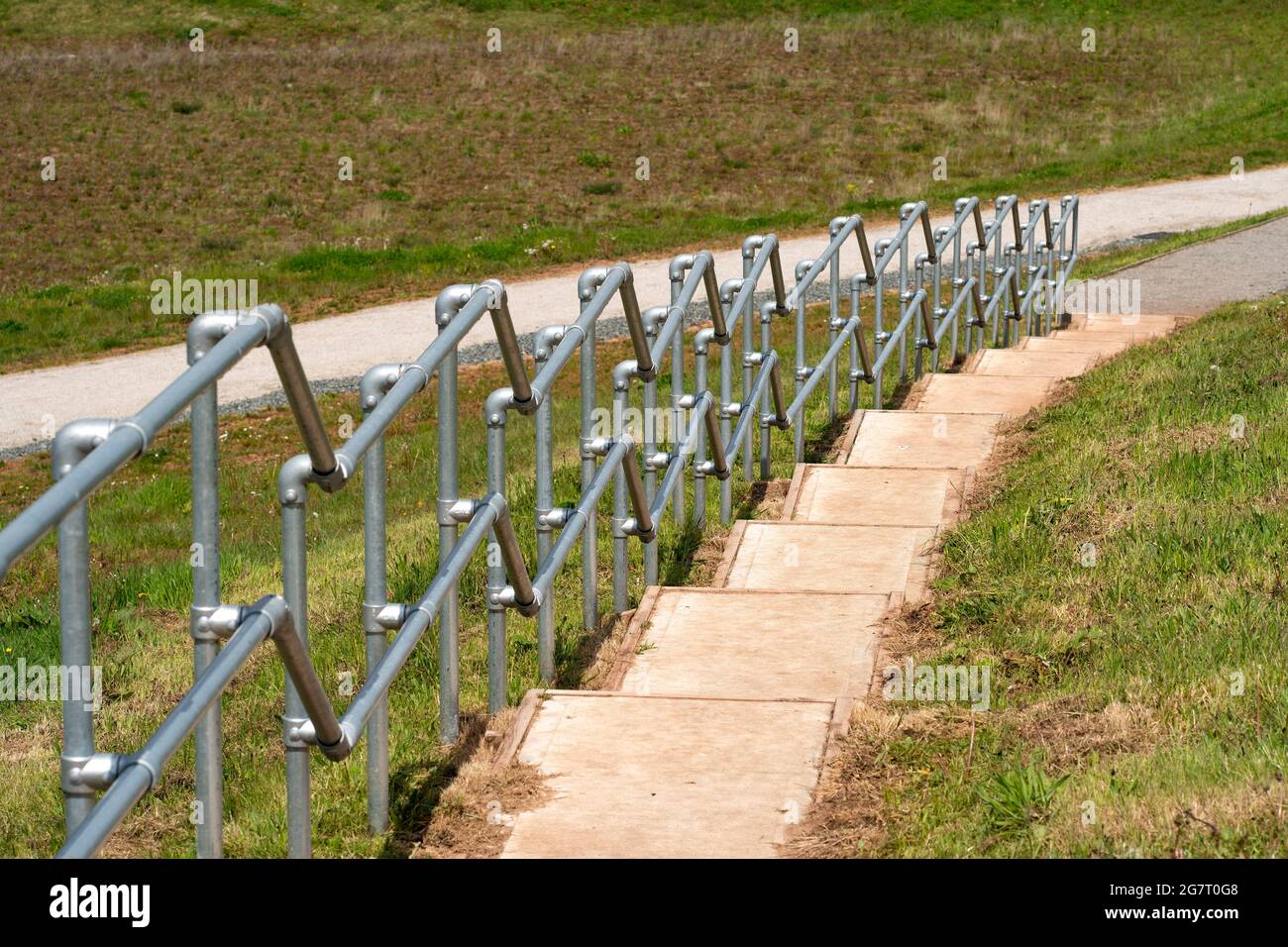 New stainless steel handrails on steps Stock Photo
