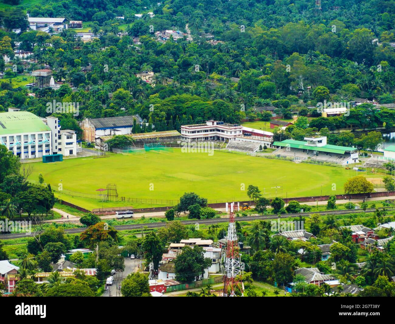 Green stadium with hills and beautiful nature around it in Maligaon