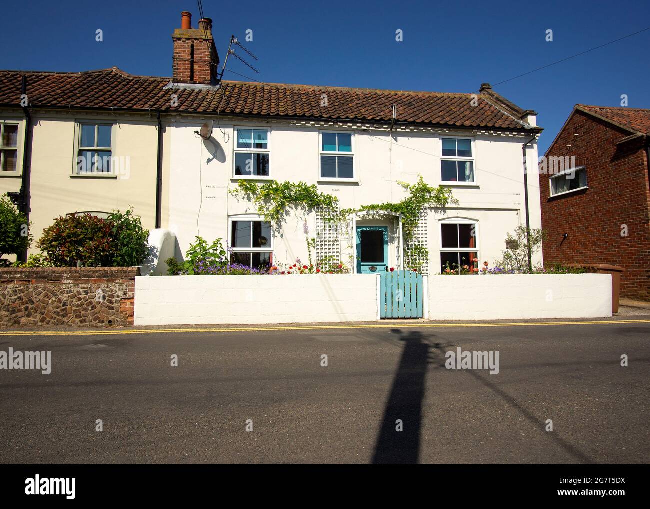 White painted cottage style home Stock Photo