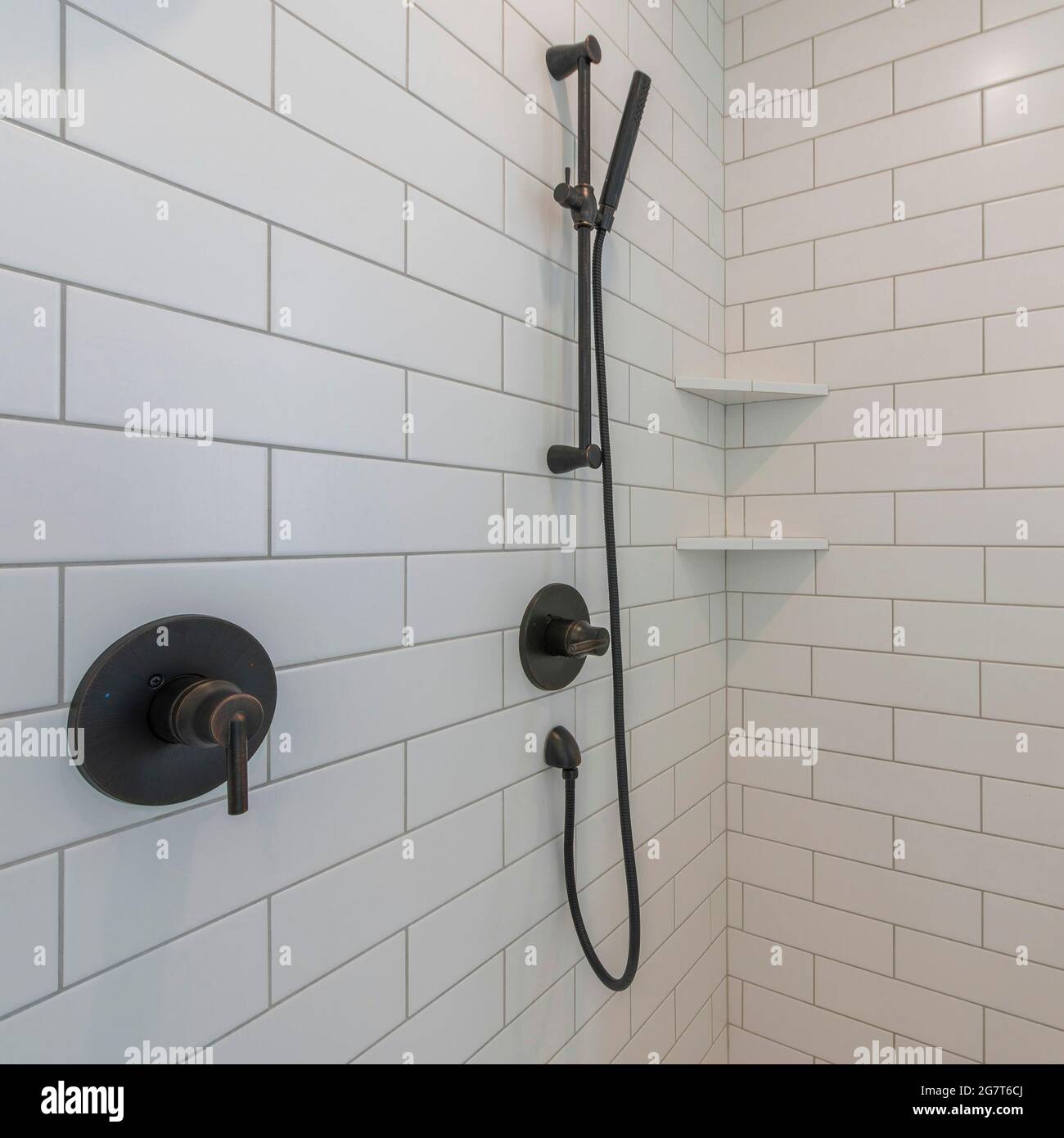 Square frame Inside a shower stall with stick handheld shower head Stock  Photo - Alamy