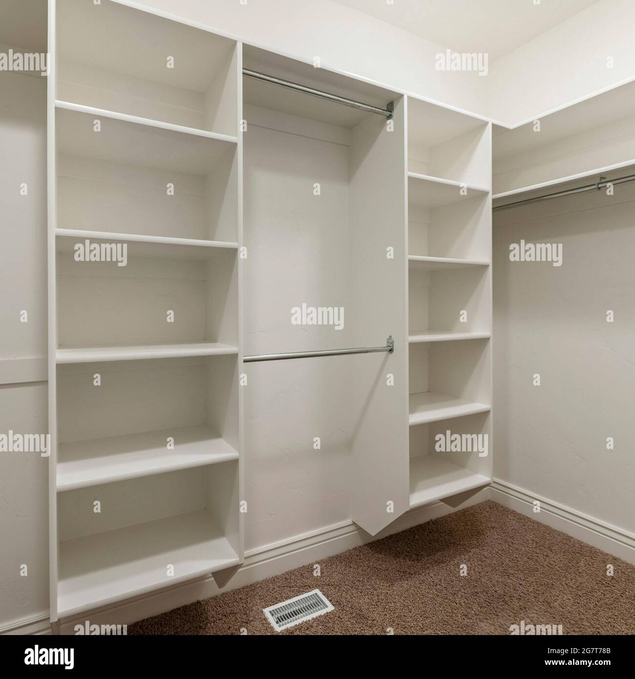 Square frame Interior of an empty walk-in closet room with floor vent Stock Photo
