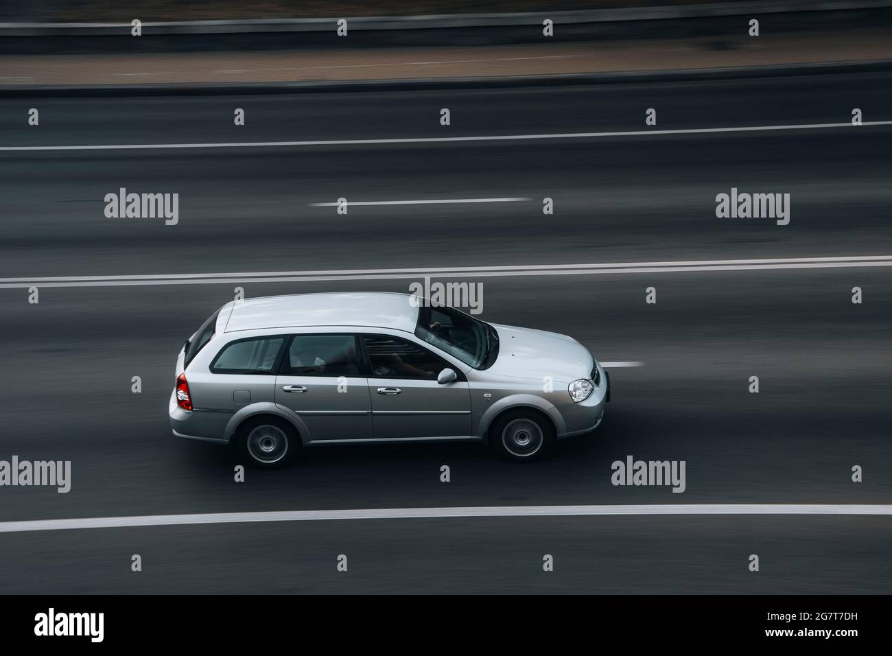 Ukraine, Kyiv - 16 July 2021: Silver Chevrolet Lacetti SX car moving on the street. Editorial Stock Photo