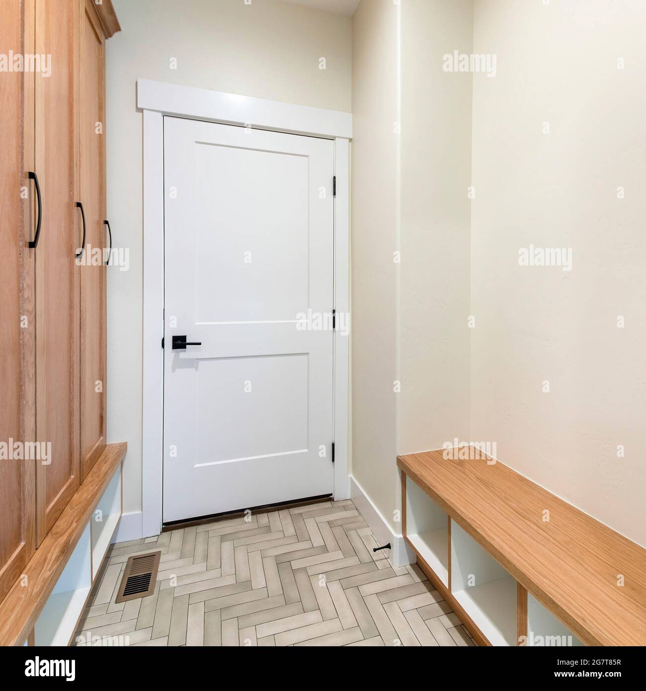 Square frame Mudroom interior with herringbone tile pattern flooring ...