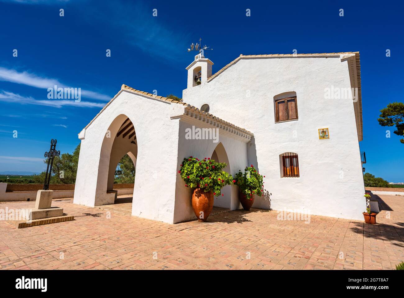 Sueca, Spain. Hermitage of the Saints. Muntanyeta dels Sants. White little building on top of a hill. Place of worship. Stock Photo