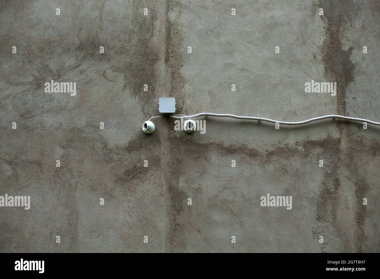 Camcorders on the wall. Installation of surveillance cameras on a