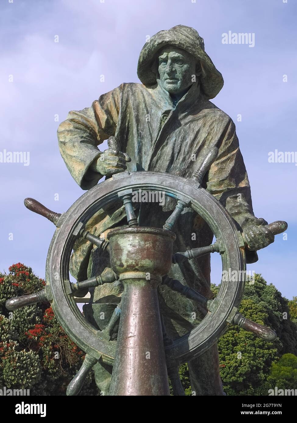 Bronze statue of a sailor with a wheel Stock Photo Alamy
