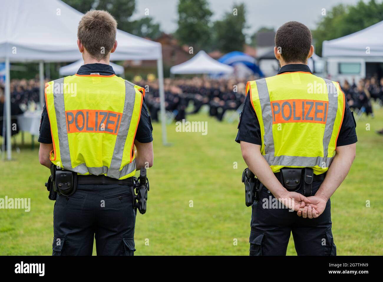 Oldenburg, Germany. 16th July, 2021. Two police officers stand in a