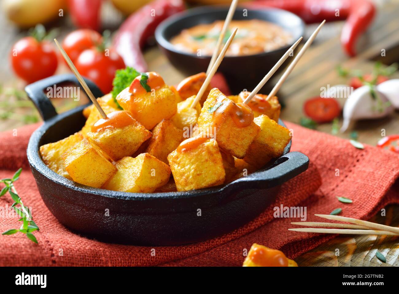 Spanish patatas bravas with spicy chili sauce, a traditional appetizer