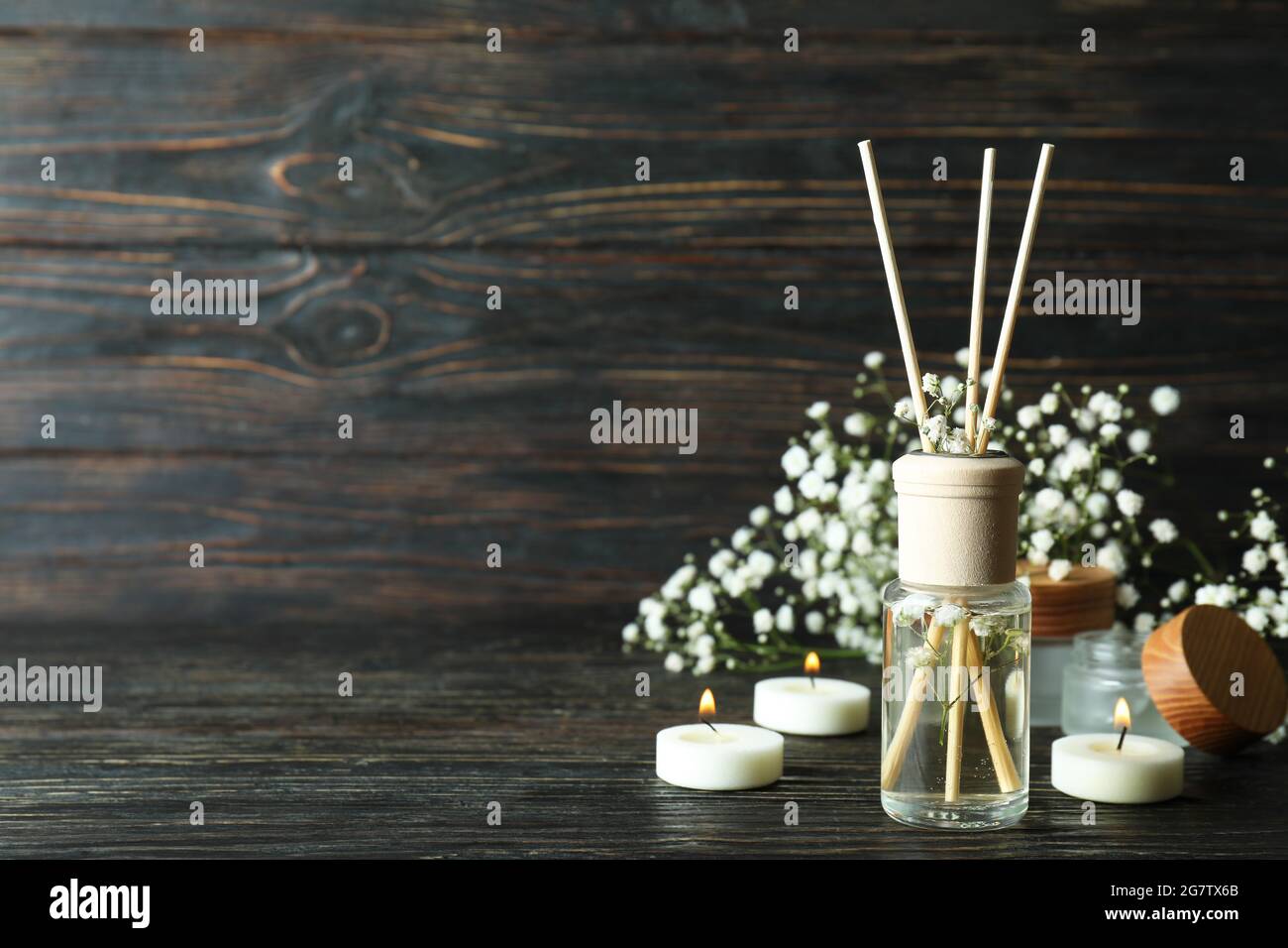 Aromatic concept with diffuser on wooden table Stock Photo