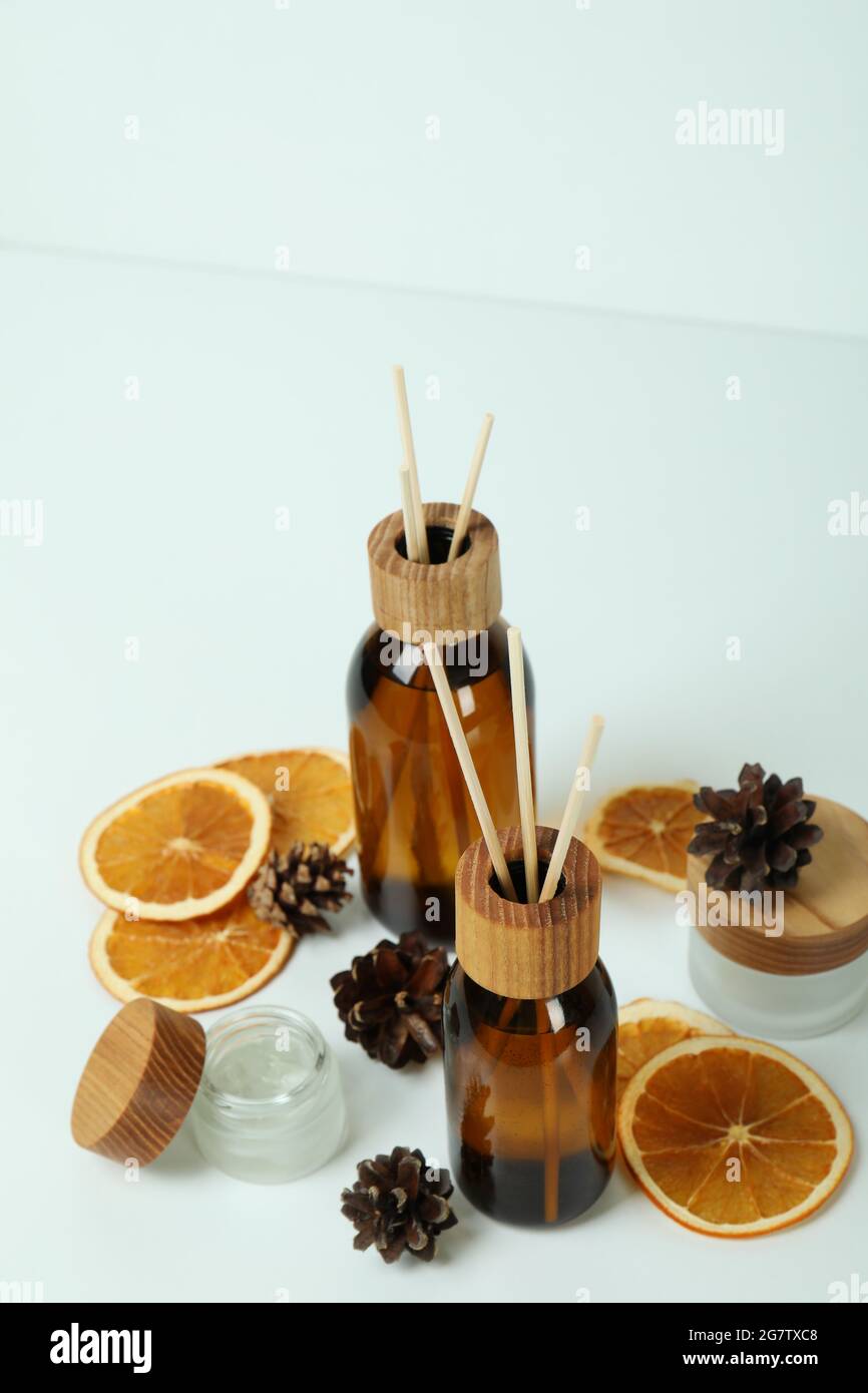 Diffusers, lemons and cones on white background Stock Photo