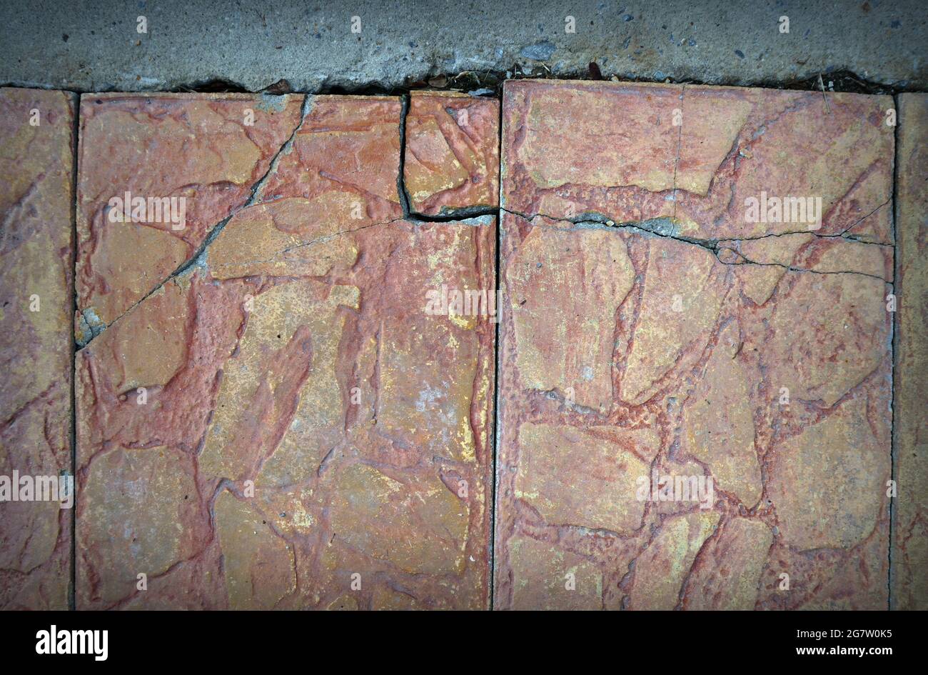 cracked cement covered with gray cement surface as background for