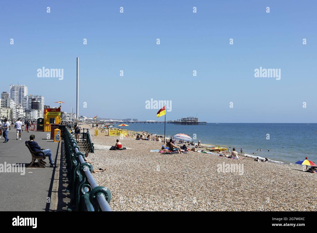 Brighton, UK. 16th July, 2021. uk weather. Day trippers enjoy blue skies and sunshine today in Brighton. Credit: Ed Brown/Alamy Live News Stock Photo