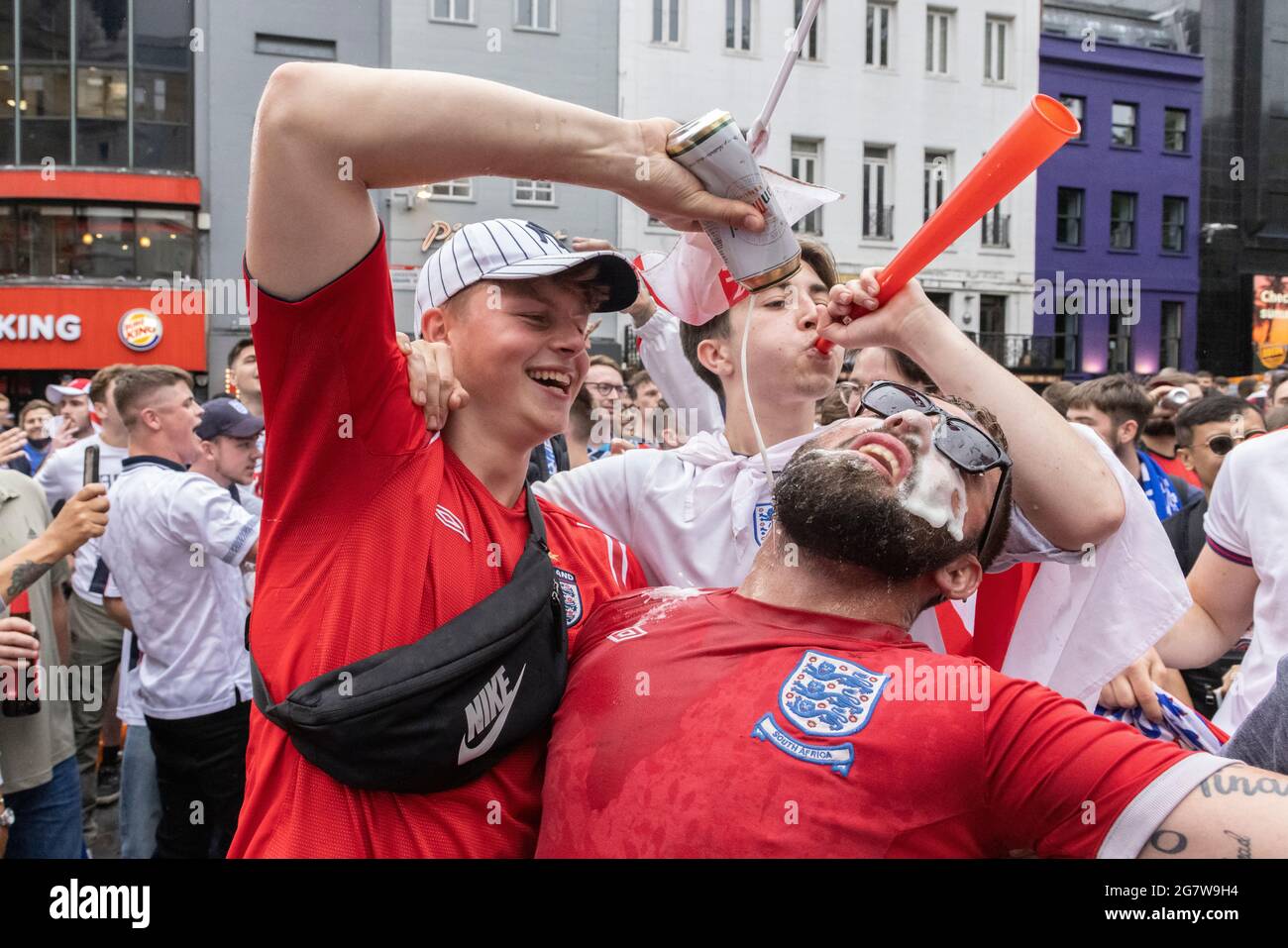 English football fans pour beer before the England vs Italy Euro 2020  final, Leicester Square, London, 11 July 2021 Stock Photo - Alamy