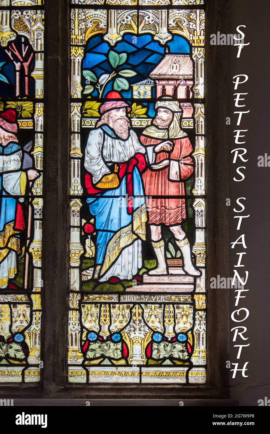 Stained glass at St Peter's church in Stainforth, North Yorkshire Stock Photo