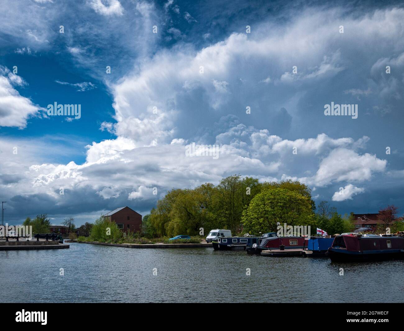 Cumulus shower cloud over Droylsden Marina, on the Ashton Canal, Droylsden, Tameside, Manchester, England, UK, Stock Photo