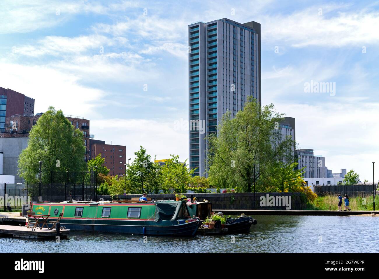 The Oxygen Tower apartment block from the Cotton Field Park marina, New Islington, Ancoats, Manchester, England, UK Stock Photo