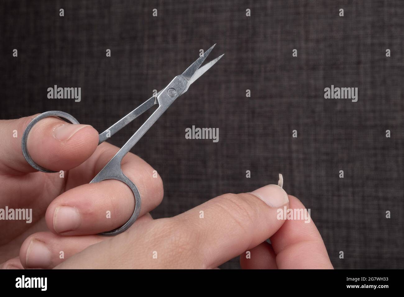 nail clipping with nail scissors closeup. Stock Photo