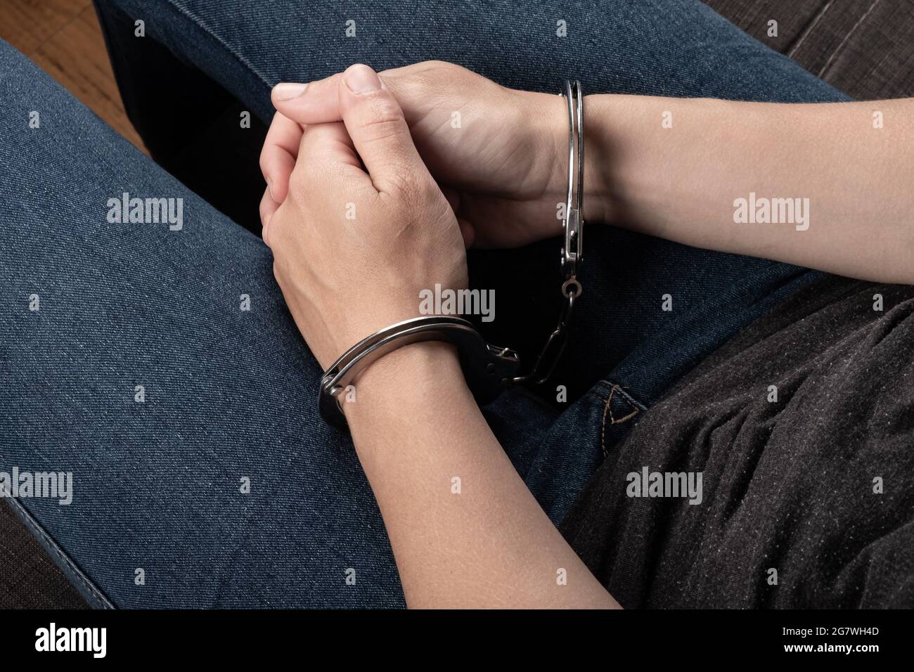 woman hands in  handcuffs , detention in a crime. Stock Photo
