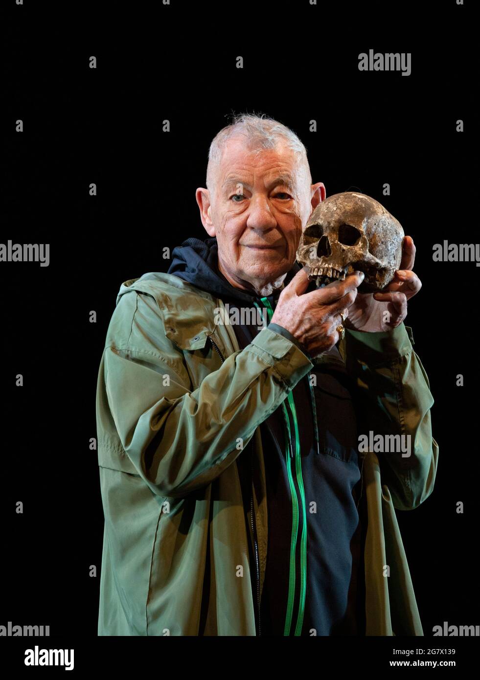 Ian McKellen as Hamlet with the skull of Yorick in HAMLET by Shakespeare opening at the Theatre Royal Windsor, England on 20/07/2021 set design: Lee Newby  costumes: Loren Epstein  wigs & make-up: Susanna Peretz  lighting: Zoe Spurr  director: Sean Mathias Stock Photo