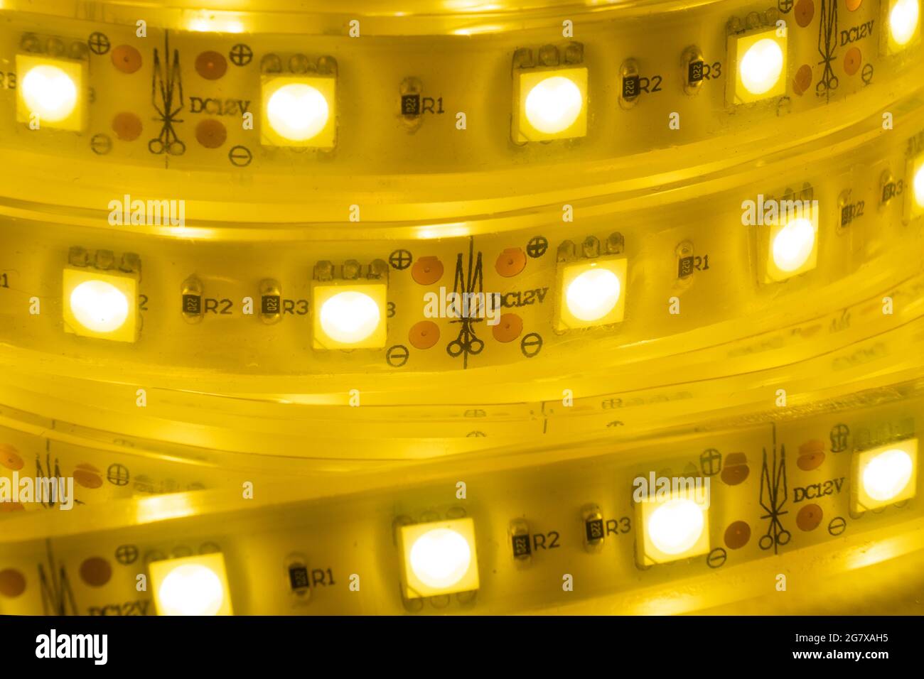 yellow led strip for home decorative light on a dark background. Stock Photo