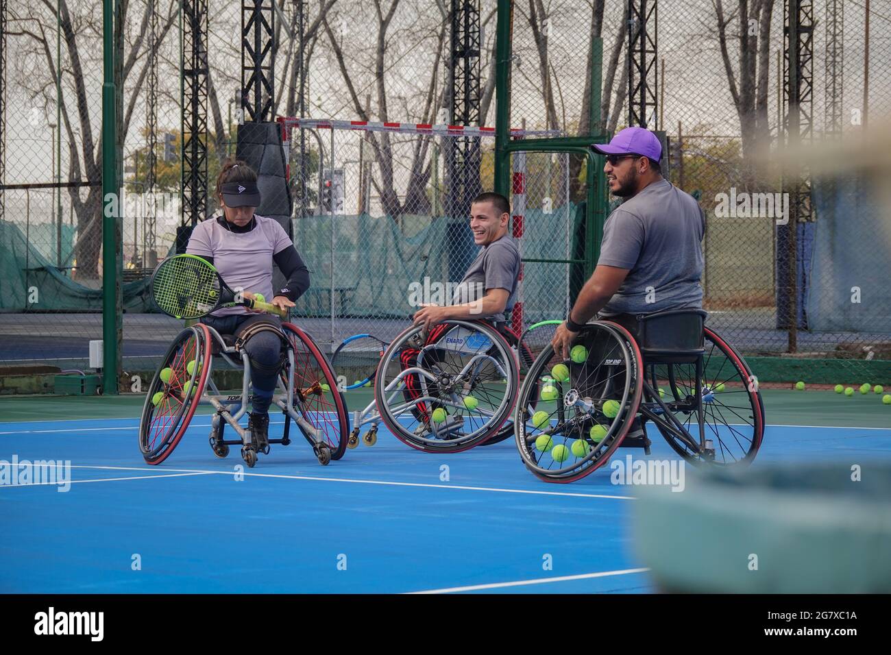 Buenos Aires, Argentina. 15th July, 2021. Tennis player Florencia Moreno (l-r) with her teammates Ezequiel Casco and Agustin Ledesma from Argentina during a training session. Moreno is the first Argentine woman to qualify for the Paralympics in wheelchair tennis. 'To be part of it is a dream,' says the tennis player. Credit: Florencia Martin/dpa/Alamy Live News Stock Photo