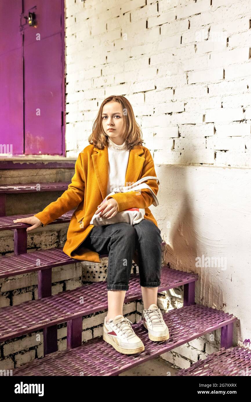 Sad girl sitting on stairs hi-res stock photography and images - Alamy