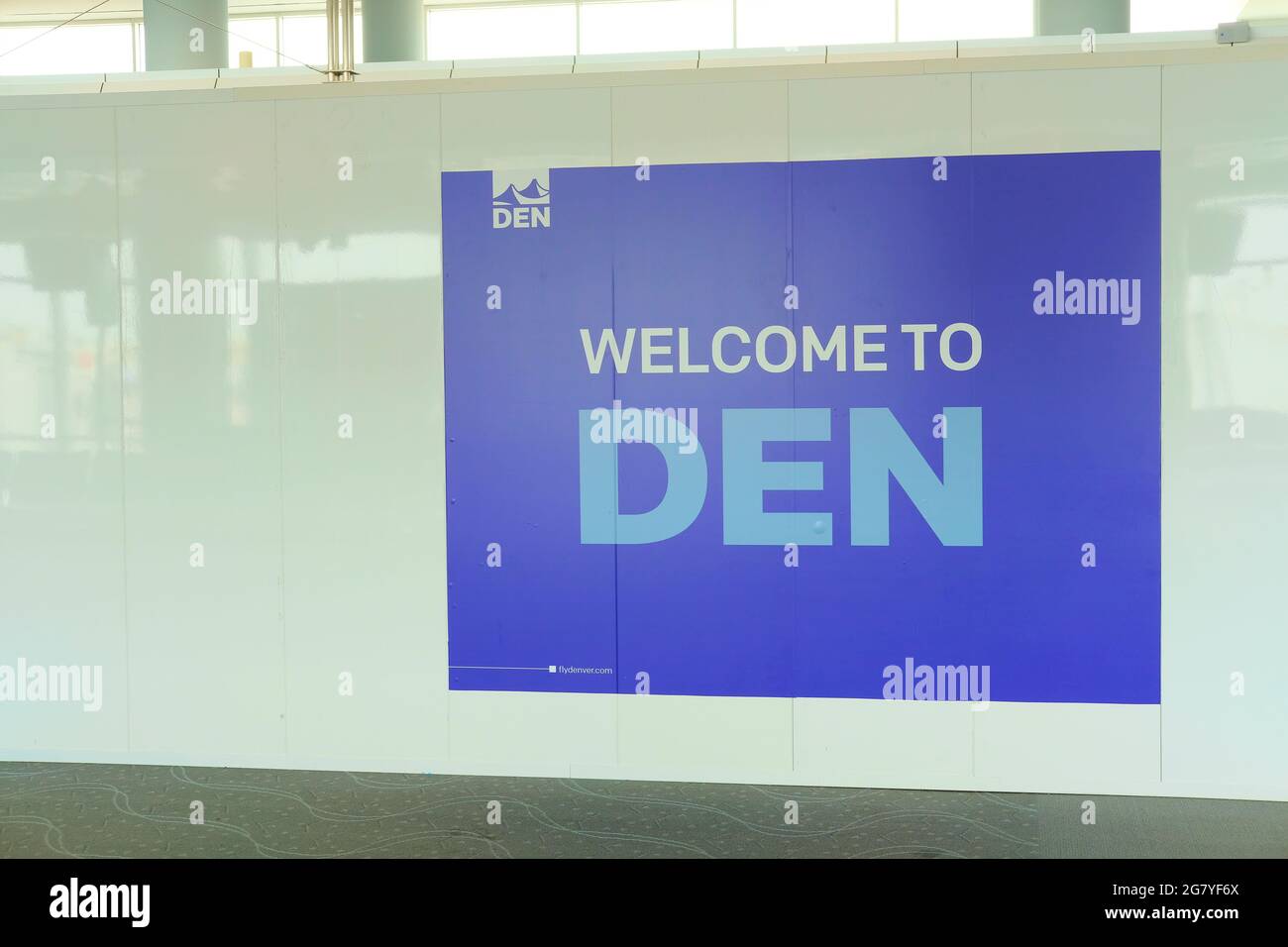 Welcome to DEN sign at a gate at the Denver International Airport, welcoming passengers flying into the Mile High City; Denver, Colorado, USA. Stock Photo