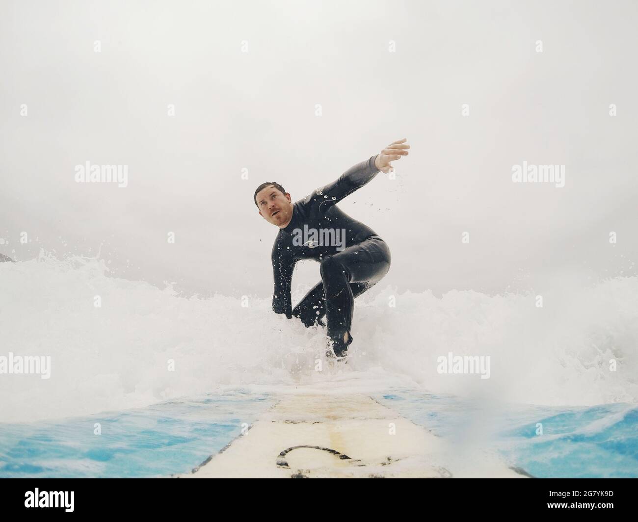 Wet suit man beach hi-res stock photography and images - Alamy