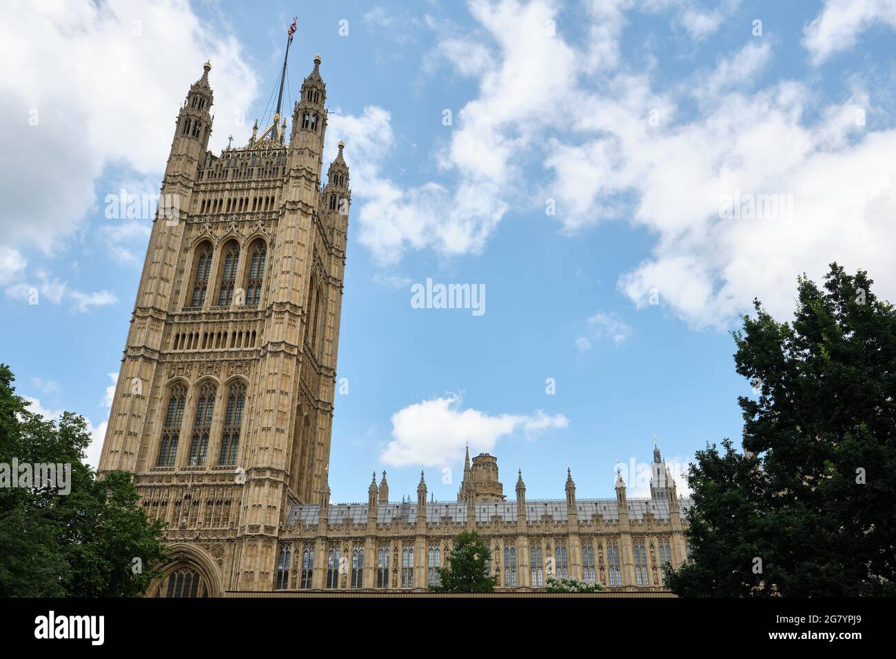 A view of the Victoria Tower at the House of Lords end of the Palace of Westminster from Victoria Tower Gardens South. Stock Photo