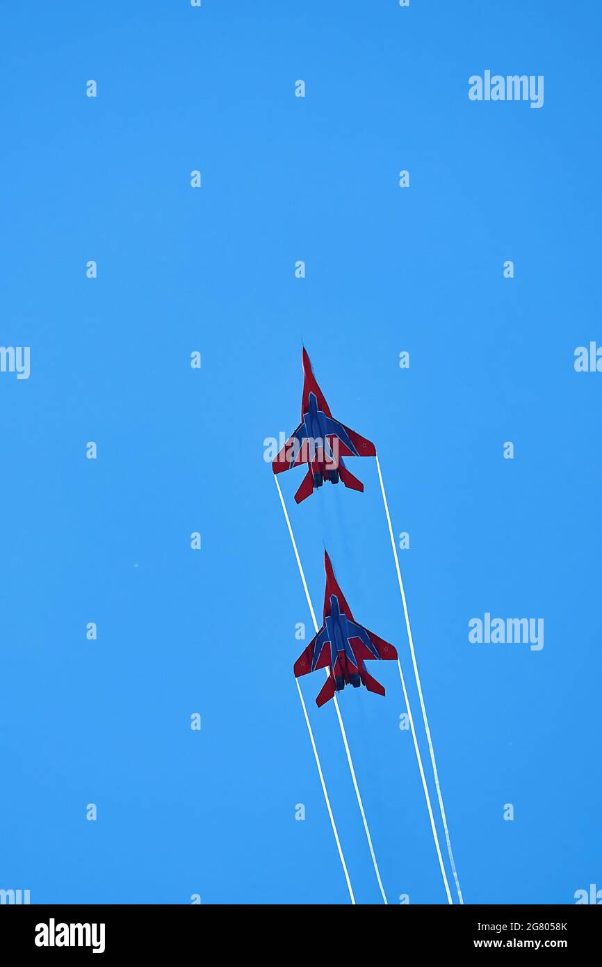 Airshow of the aerobatic team Strizhi - The Swifts. Aerobatic Team on ...