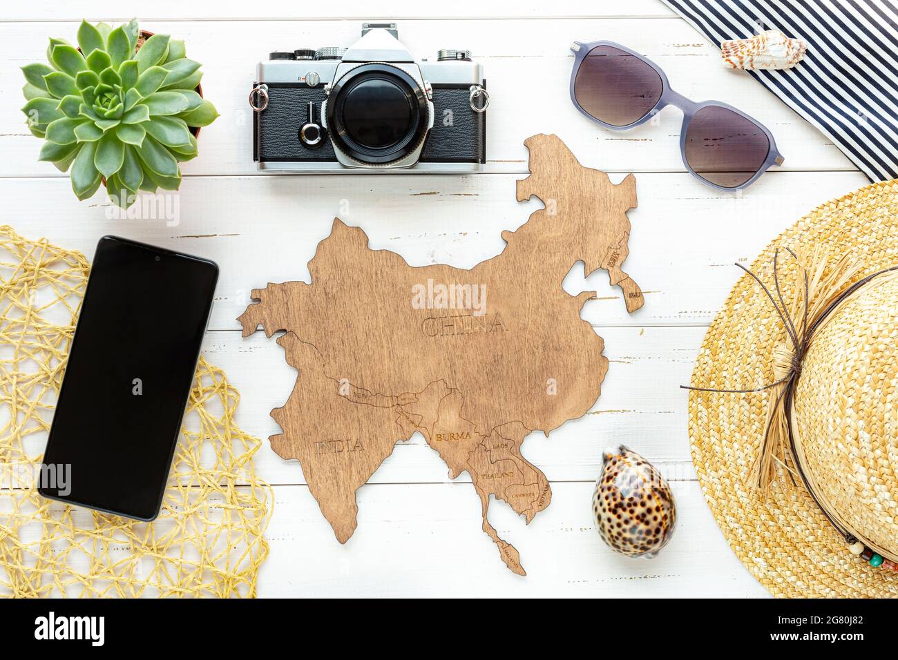 Tourist destinations to Asian tropical countries. On a white background wooden map with countries - China, India, Korea, Vietnam, Cambodia, and others Stock Photo