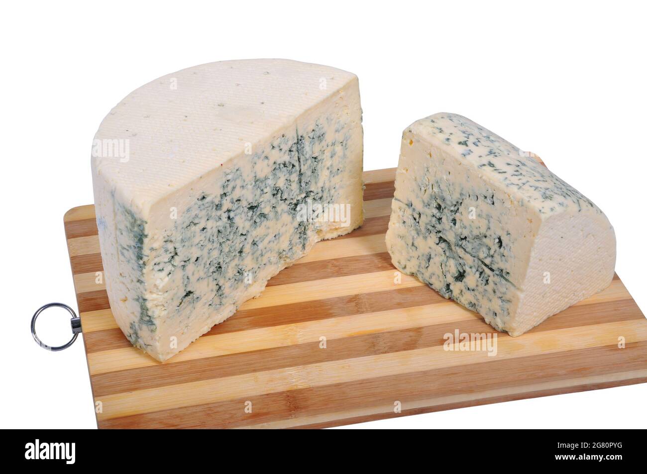 Traditional moldy soft blue cheese, on cutting board, isolated on white