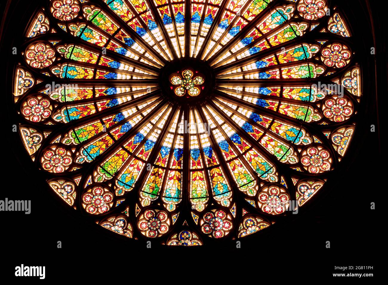 Strasbourg, Alace/ France - 10/10/2020: Rosette, huge beautiful stained glass rose window by the interior of notre dame cathedral in Strasbourg Stock Photo